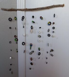 completed art project by Roxanne Troup of a recycled garden wind chime