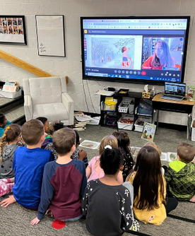 photo of a virtual author visit with Roxanne Troup showing students listening intently